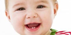 When does a child's first tooth appear?