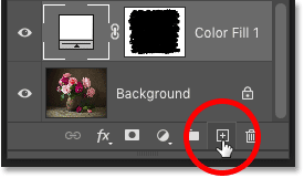 Clicking the Add New Layer icon in the Layers panel in Photoshop