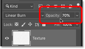 Réduisez l'opacité du calque de texture dans le panneau Calques Photoshop