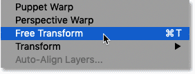 Selecting the Free Transform command from the Edit menu in Photoshop