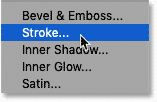 Add a Stroke layer effect in the Layers panel in Photoshop