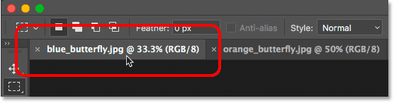 Clicking tabs to switch between open images in Photoshop.
