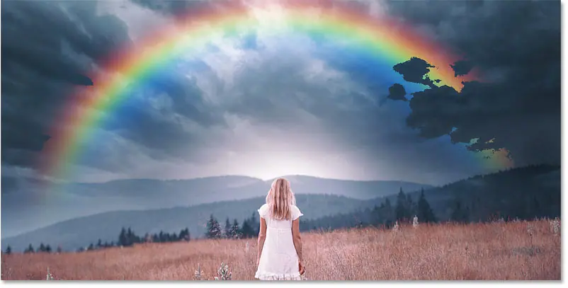 Dark clouds appear from the image through the rainbow in Photoshop