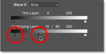 Drag each half of the black slider in Photoshop's Blending Options