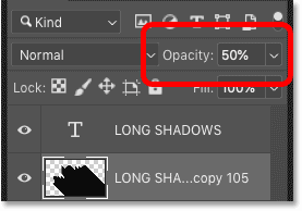 Lower the shadow's opacity to 50 percent in the Layers panel in Photoshop