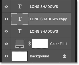 A second black type layer appears below the original text in the Layers panel in Photoshop