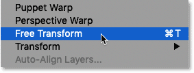 Selecting the Free Transform command from the Edit menu in Photoshop