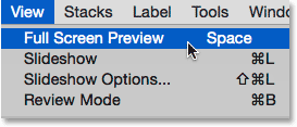 Select the Full Screen Preview option under the View menu in Adobe Bridge. Image © 2015 Photoshop Essentials.com