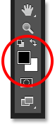 Foreground and background color swatches in the Tools panel. Image © 2016 Photoshop Essentials.com
