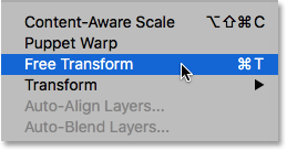 Select the Free Transform command from the Edit menu. Image © 2016 Photoshop Essentials.com