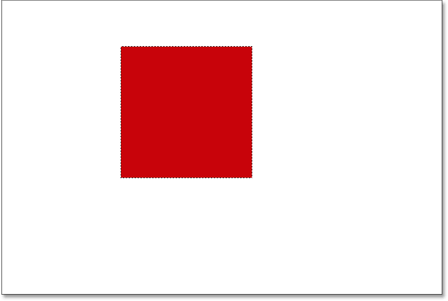 The selection is filled with red. Image © 2016 Photoshop Essentials.com